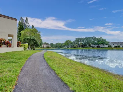 a view of a lake with a yard