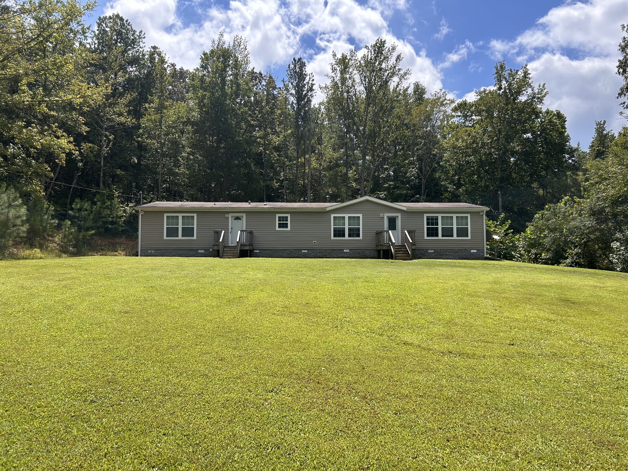 7111 Wink Parker Road Lyles, TN 37098 - Photo 1 of 47 a house view with swimming pool in front of it