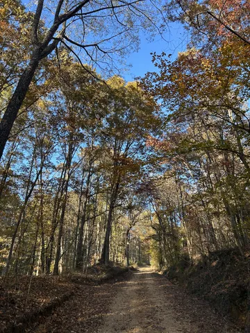 a living room with a large window and furniture