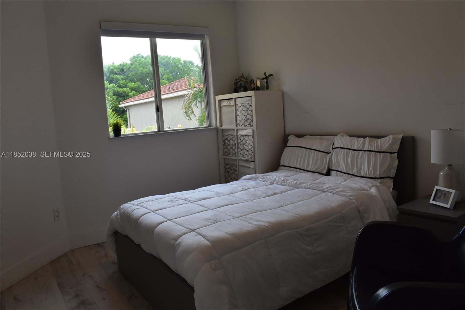 5189 Northwest 108th Path Doral, FL 33178 - Photo 15 of 23 a bedroom with a bed and a window