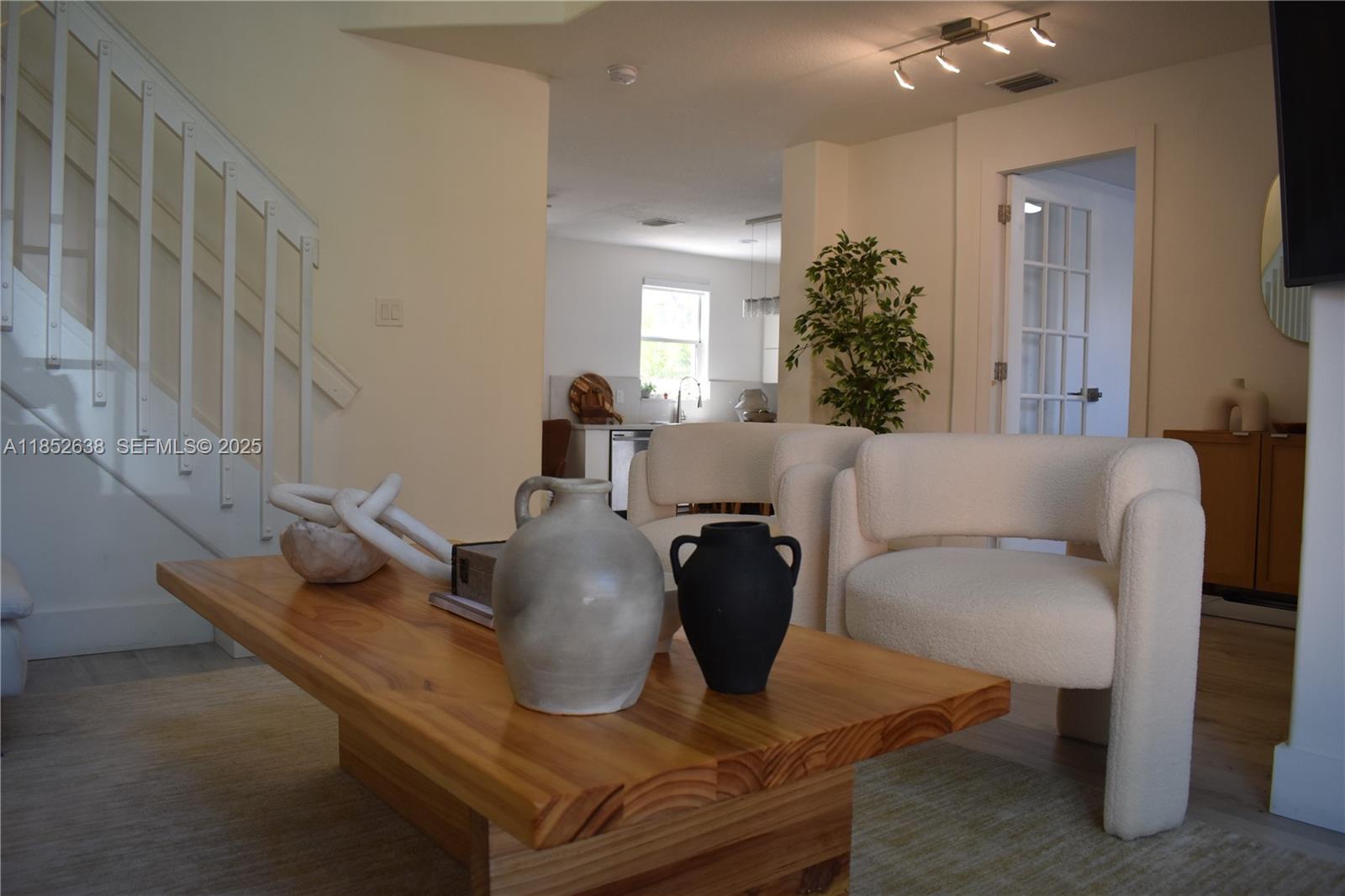 5189 Northwest 108th Path Doral, FL 33178 - Photo 18 of 23 a living room with furniture and a potted plant