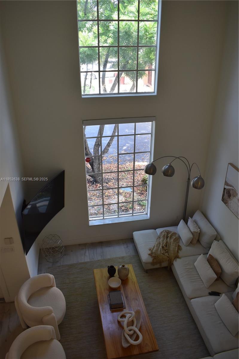 5189 Northwest 108th Path Doral, FL 33178 - Photo 5 of 23 a bedroom with furniture and a window