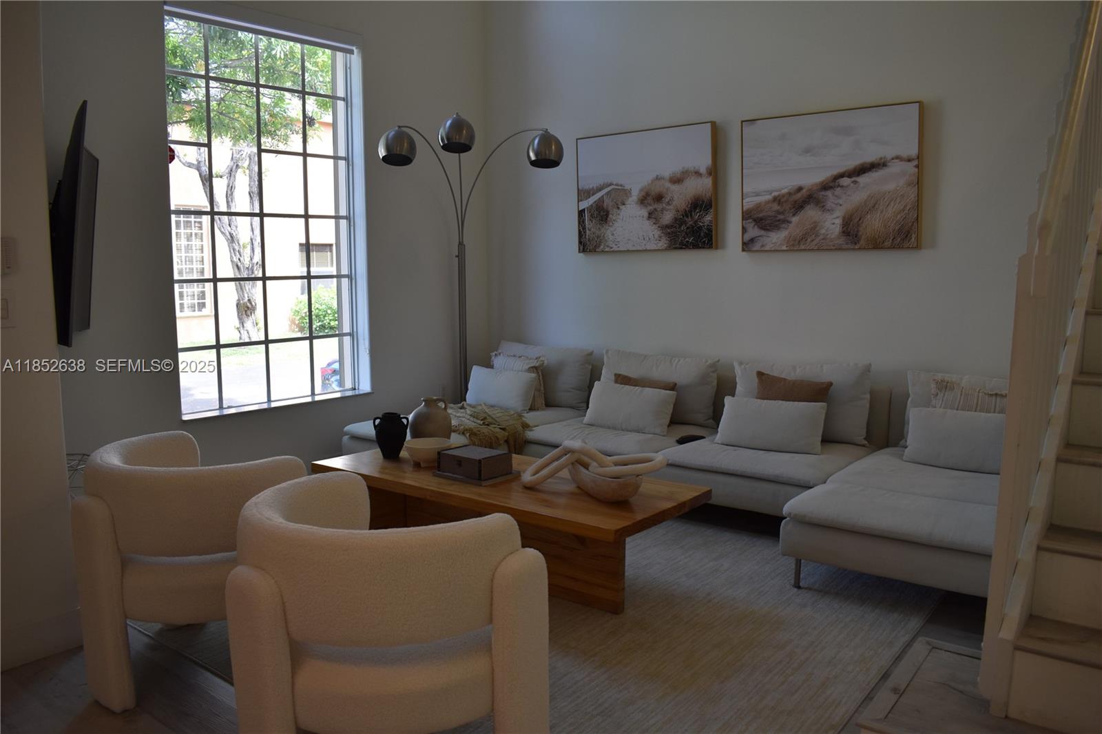 5189 Northwest 108th Path Doral, FL 33178 - Photo 6 of 23 a living room with furniture and a window