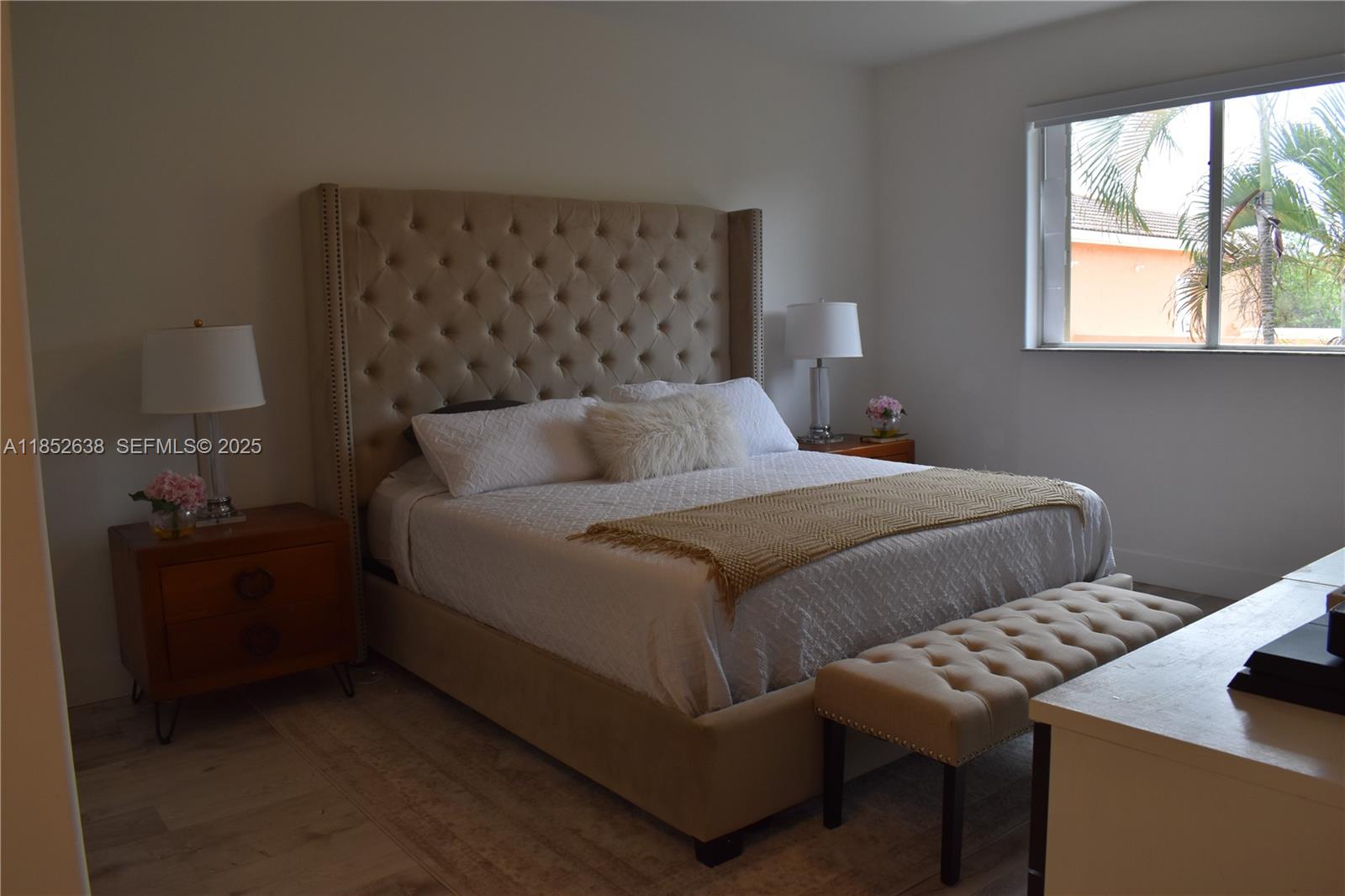 5189 Northwest 108th Path Doral, FL 33178 - Photo 8 of 23 a bedroom with bed and window