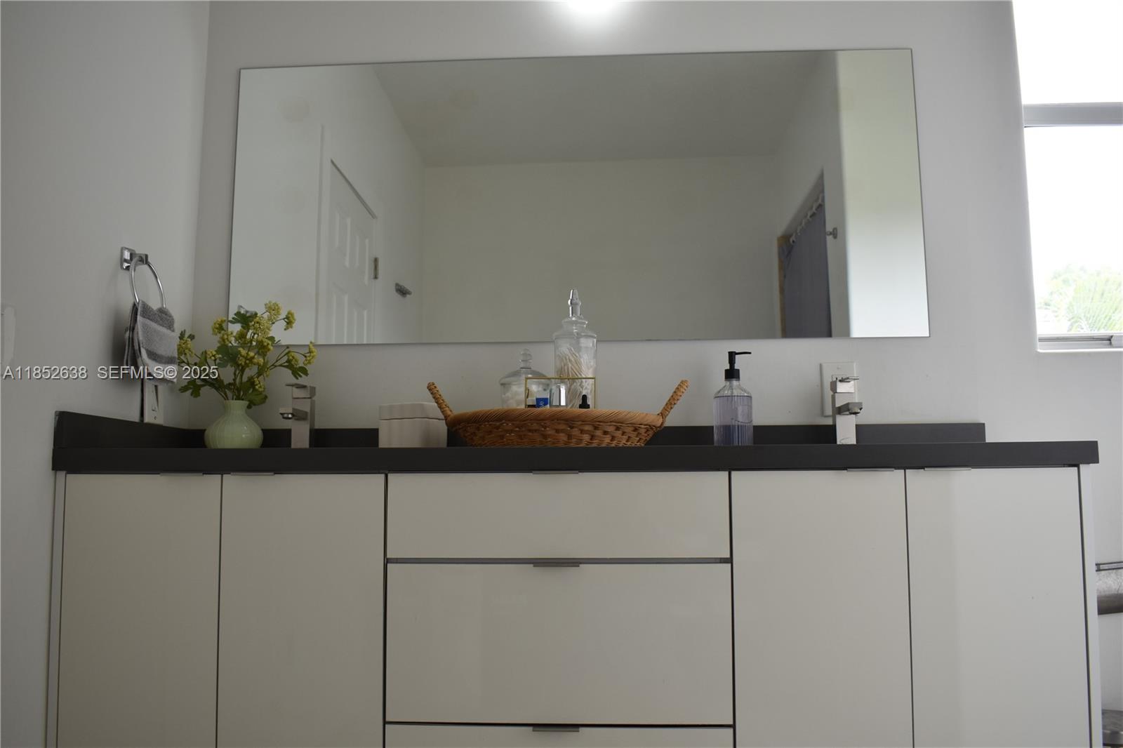 5189 Northwest 108th Path Doral, FL 33178 - Photo 9 of 23 a bathroom with a sink and a mirror