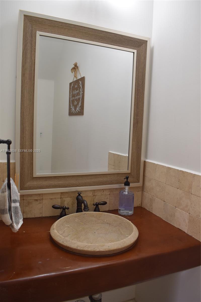 5189 Northwest 108th Path Doral, FL 33178 - Photo 10 of 23 a bathroom with a sink and a mirror