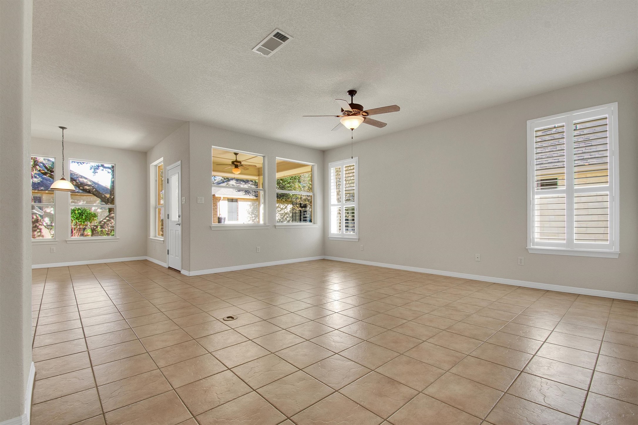 102 Lavaca Lane Georgetown, TX 78628 - Photo 9 of 30 Great Room with breakfast nook in the background (left), door in the background leads to the patio