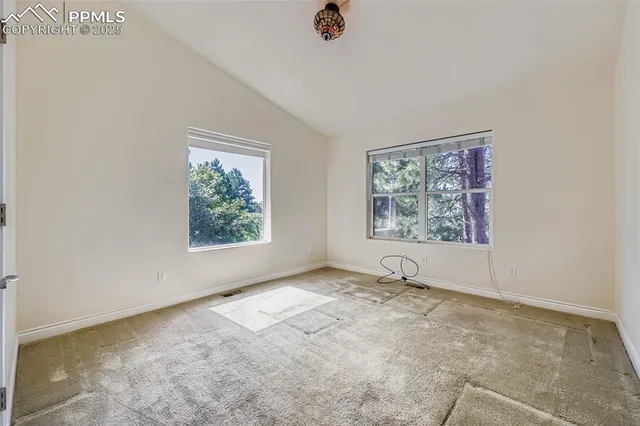 an empty room with windows