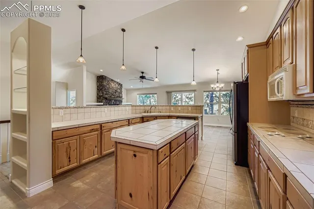 a kitchen that has a lot of cabinets in it