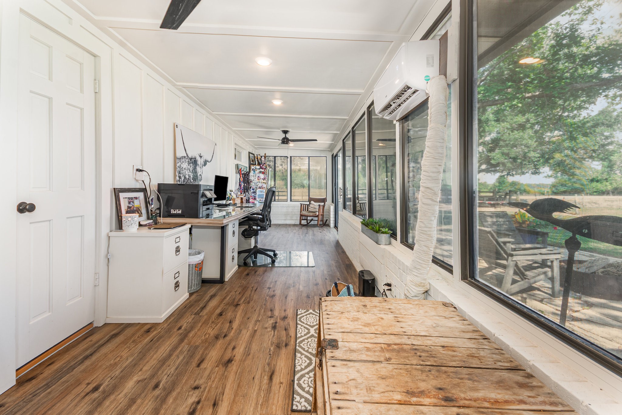 12009 Dannhaus Road Needville, TX 77461 - Photo 15 of 49 a kitchen with stainless steel appliances kitchen island granite countertop a stove a refrigerator a sink and white cabinets with wooden floor