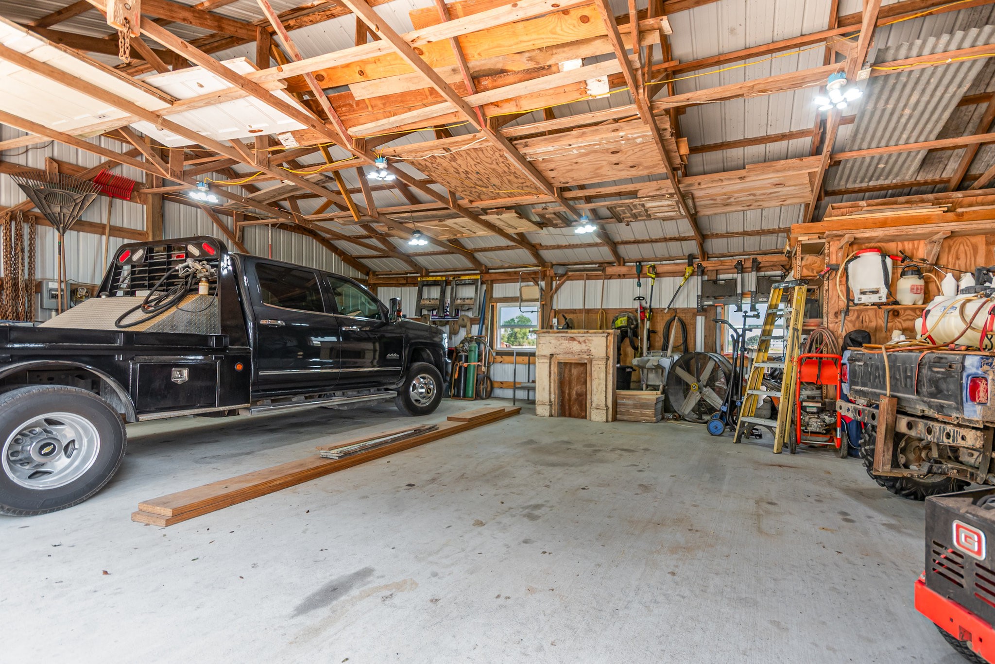 12009 Dannhaus Road Needville, TX 77461 - Photo 25 of 49 a view of a garage with parked cars