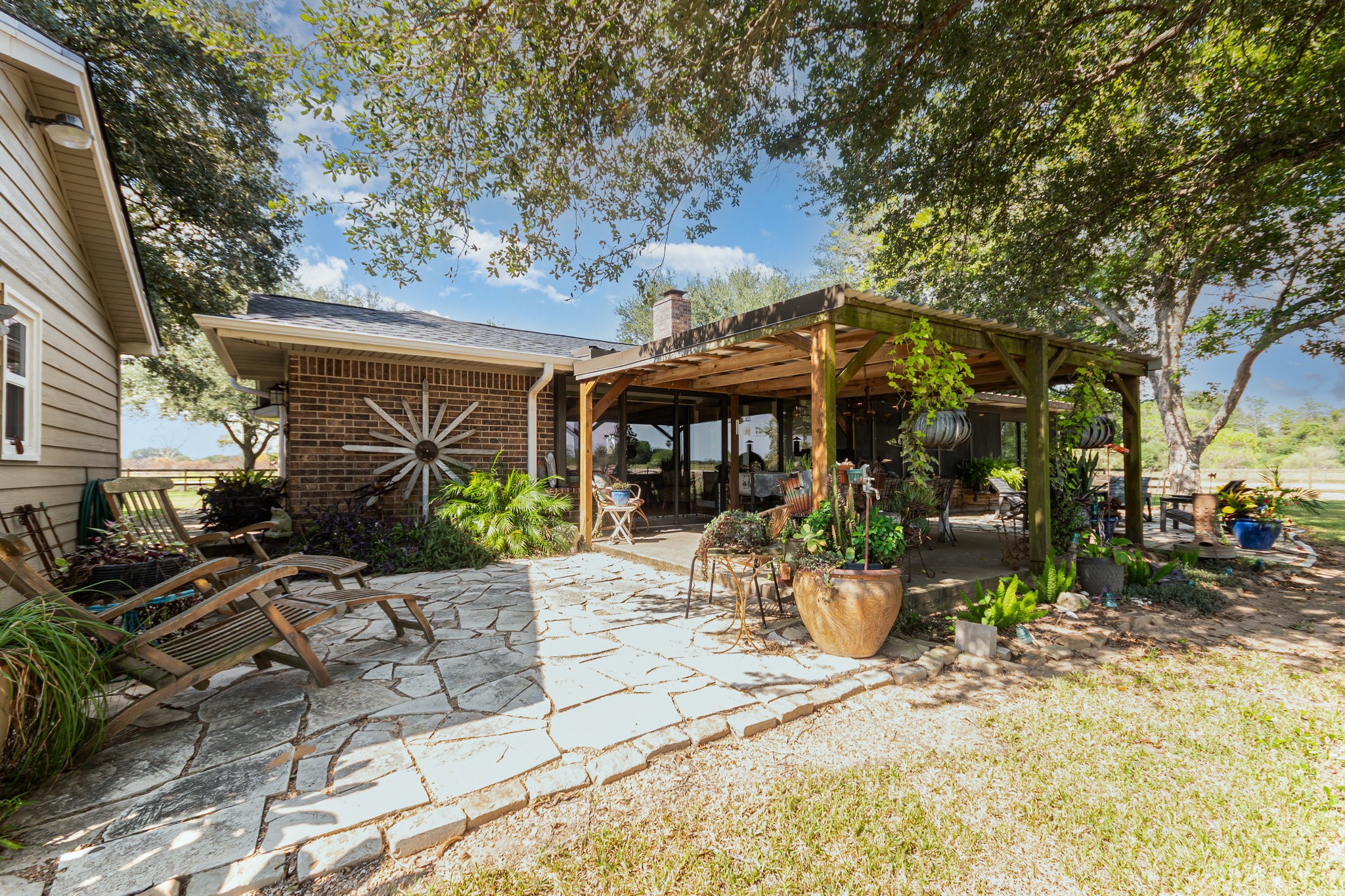 12009 Dannhaus Road Needville, TX 77461 - Photo 29 of 49 a view of a table and chairs in patio