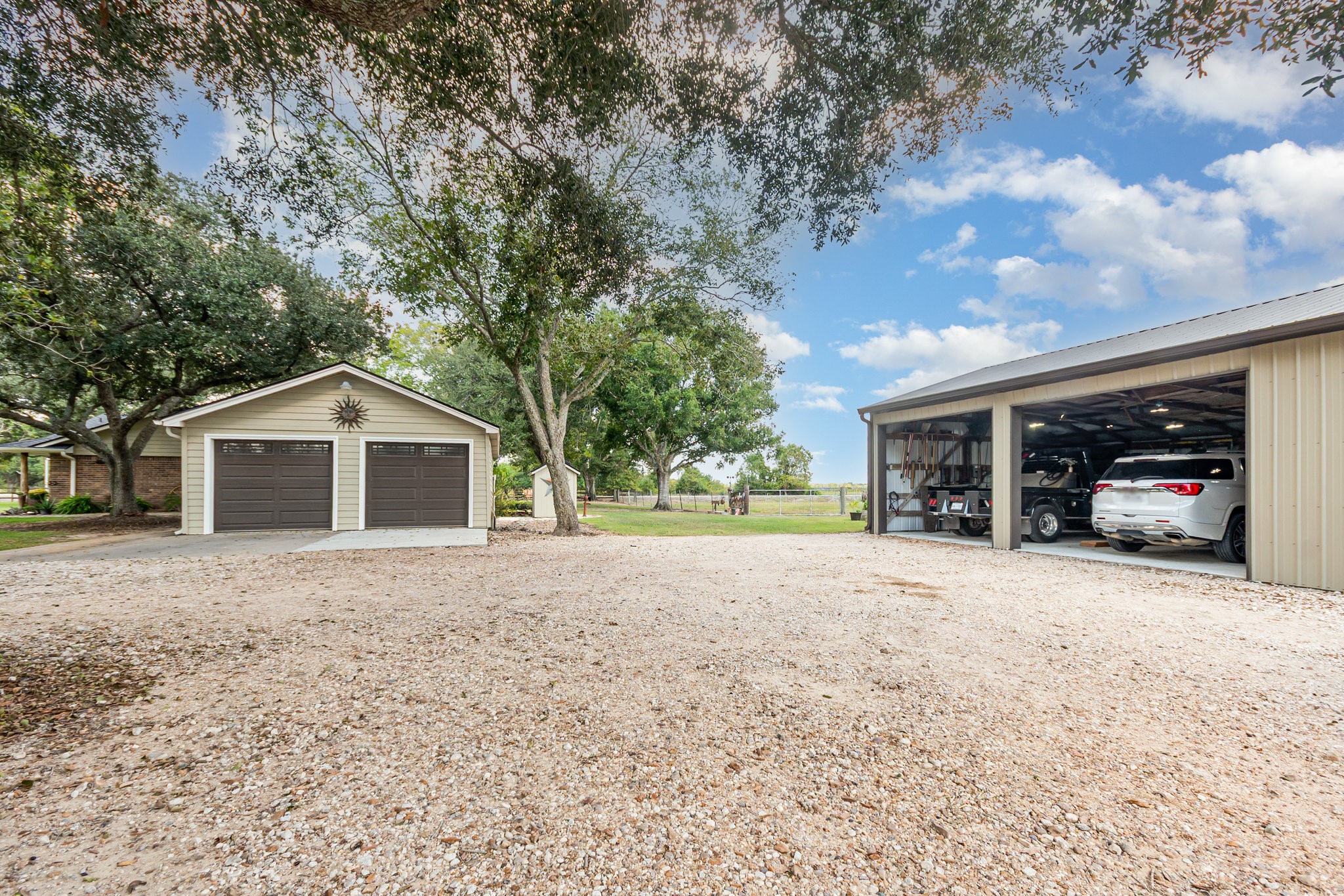 12009 Dannhaus Road Needville, TX 77461 - Photo 32 of 49 a front view of a house with a yard and garage