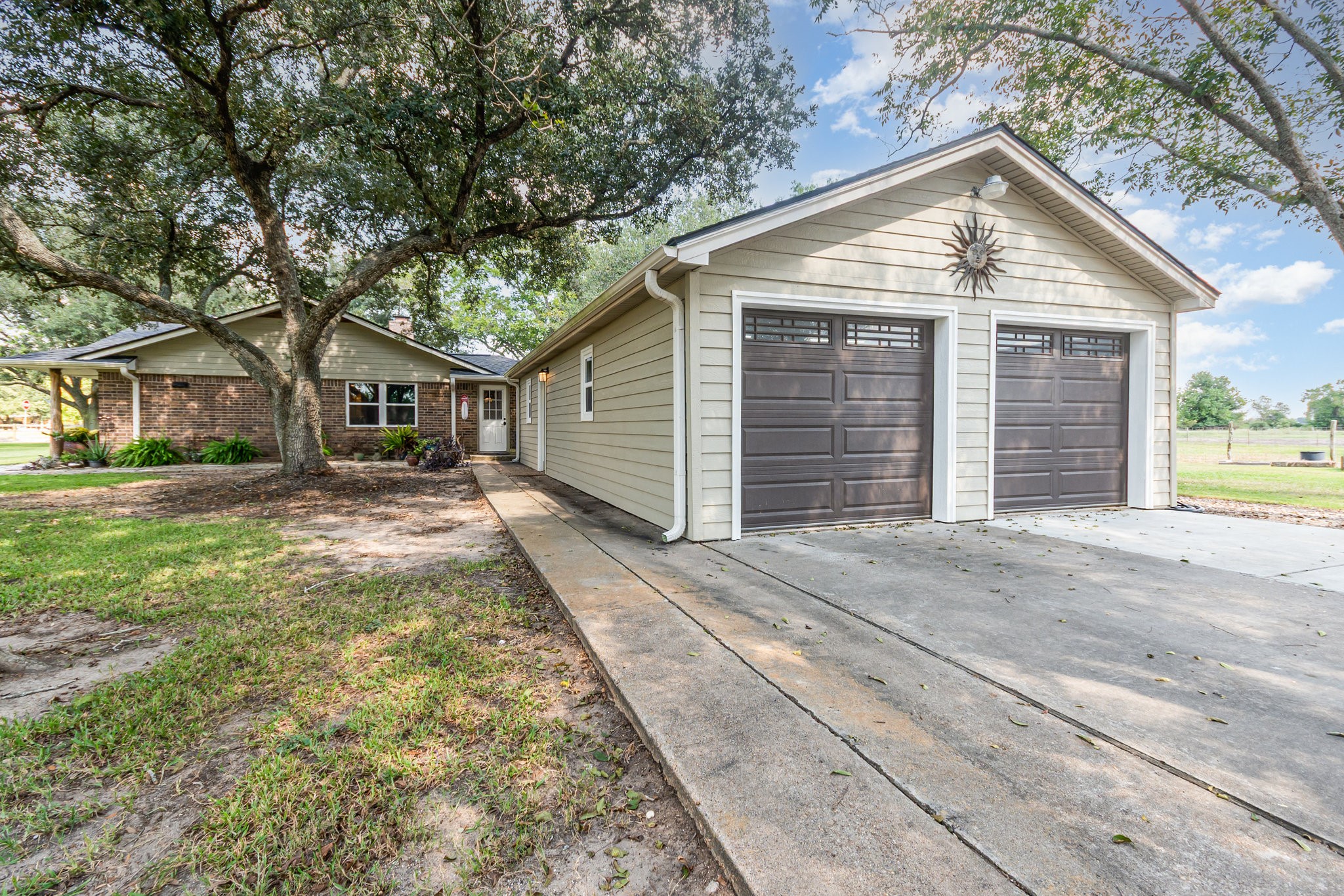 12009 Dannhaus Road Needville, TX 77461 - Photo 33 of 49 a front view of a house with a yard and garage