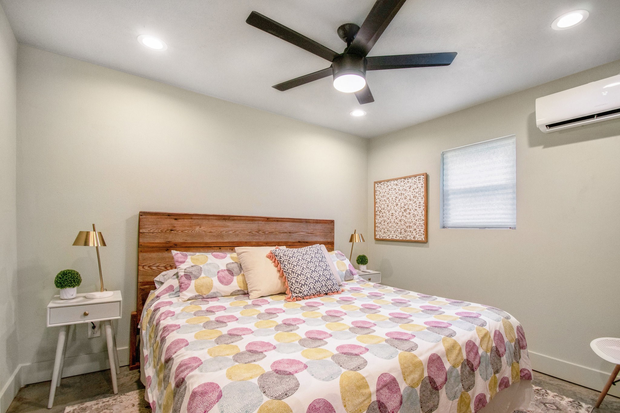 12009 Dannhaus Road Needville, TX 77461 - Photo 40 of 49 a bedroom with a bed and a chandelier