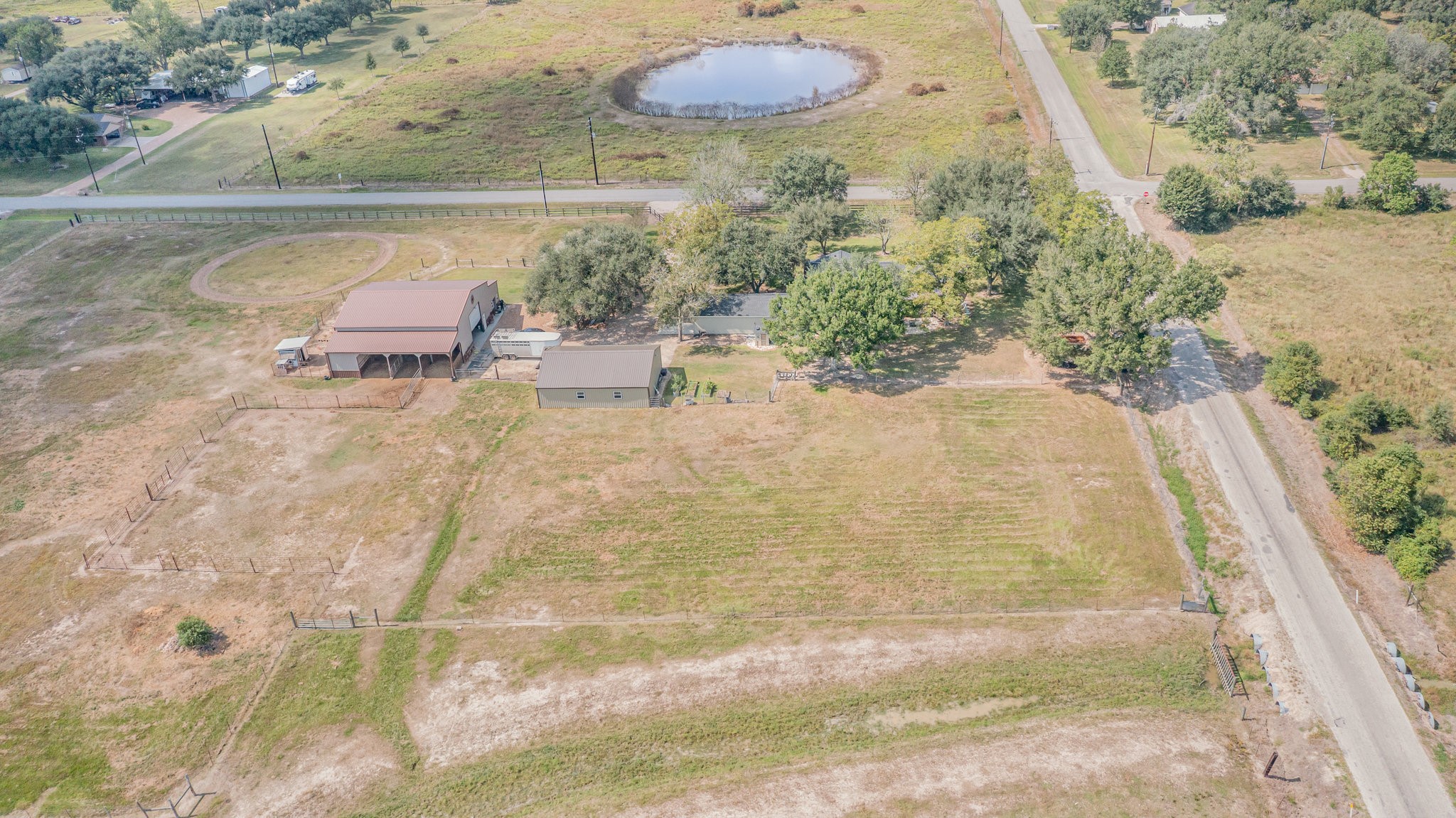 12009 Dannhaus Road Needville, TX 77461 - Photo 44 of 49 a view of a swimming pool with a yard