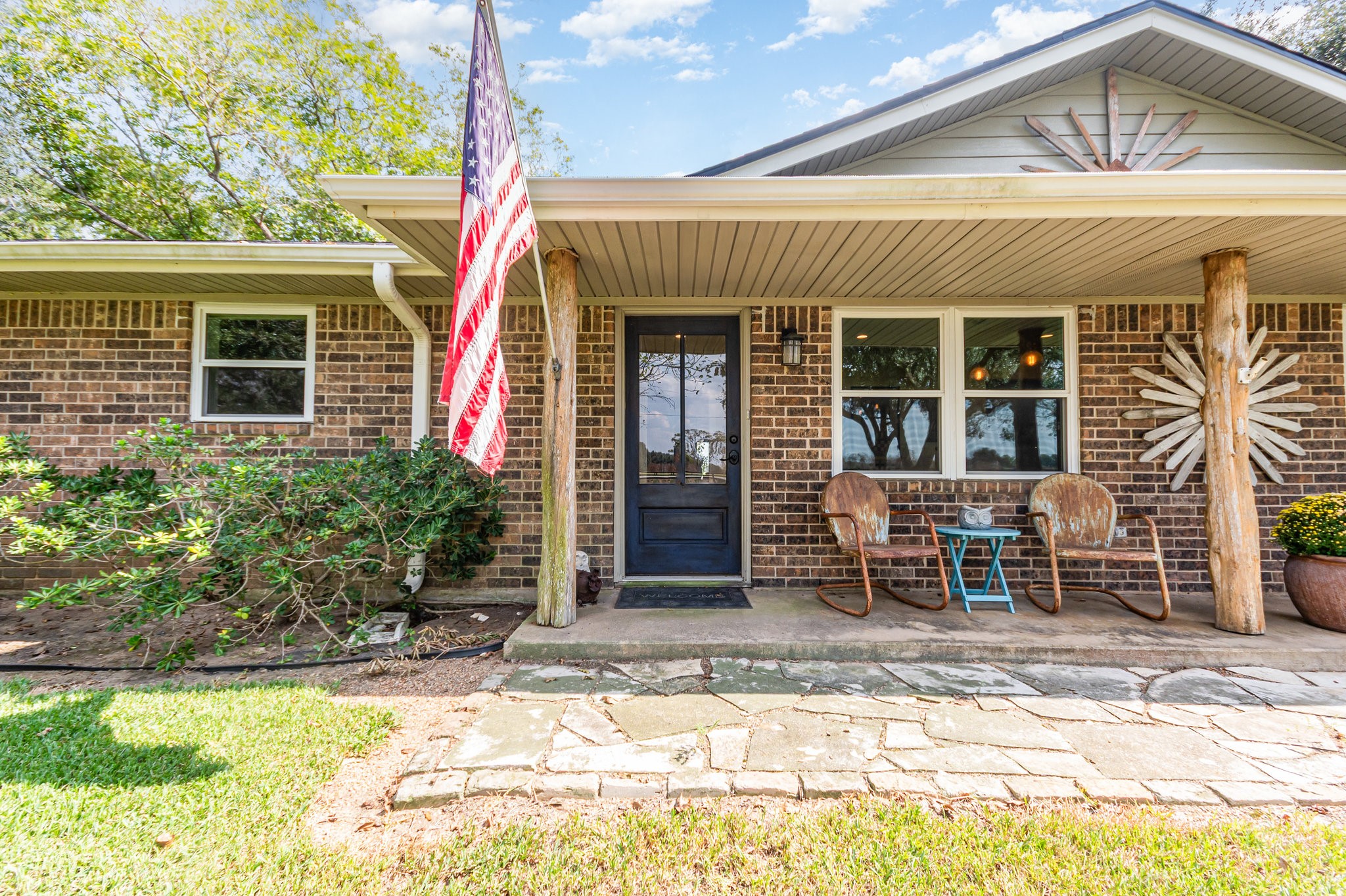 12009 Dannhaus Road Needville, TX 77461 - Photo 5 of 49 a view of a house with a patio and a yard