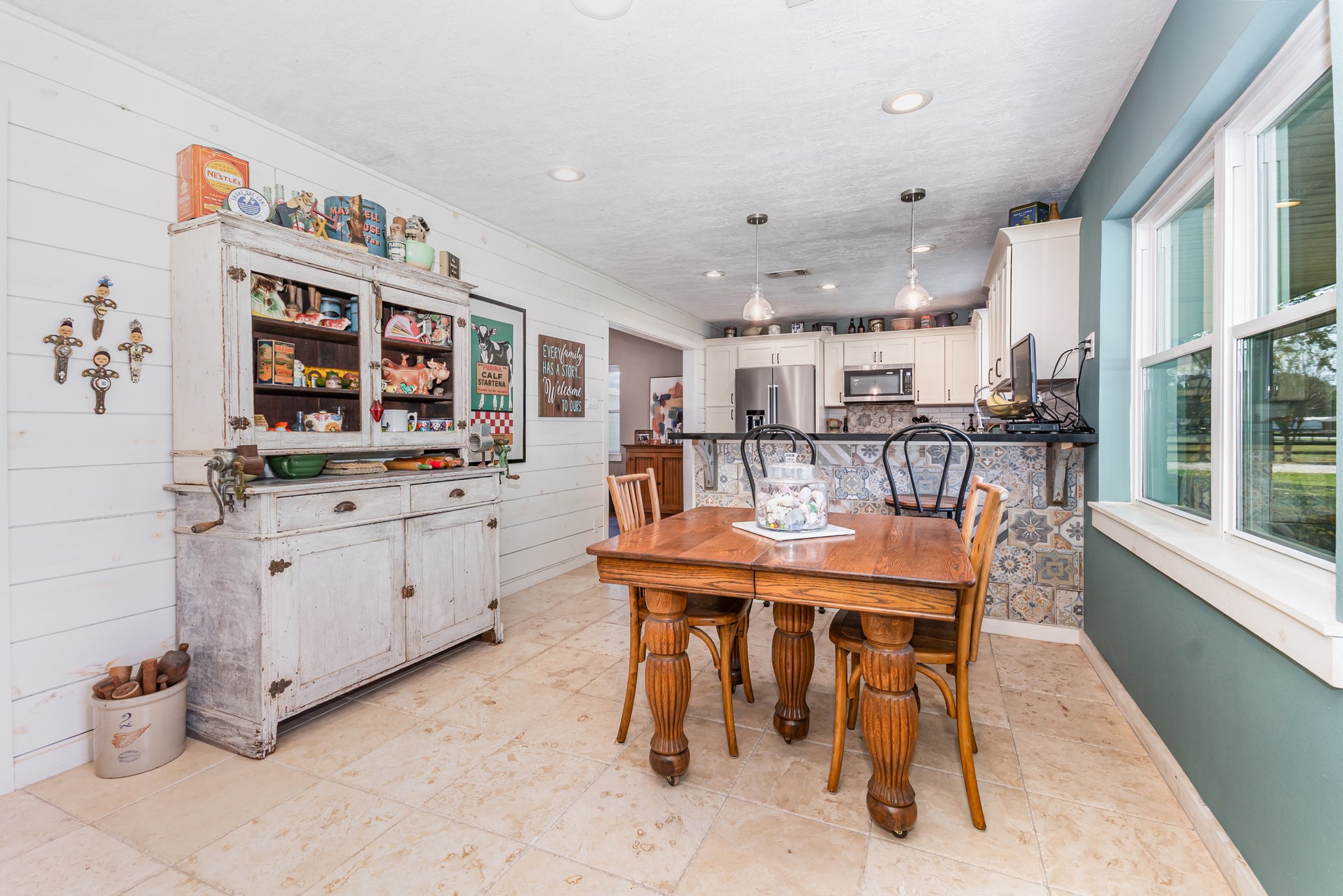12009 Dannhaus Road Needville, TX 77461 - Photo 6 of 49 a kitchen with stainless steel appliances kitchen island granite countertop a sink and cabinets