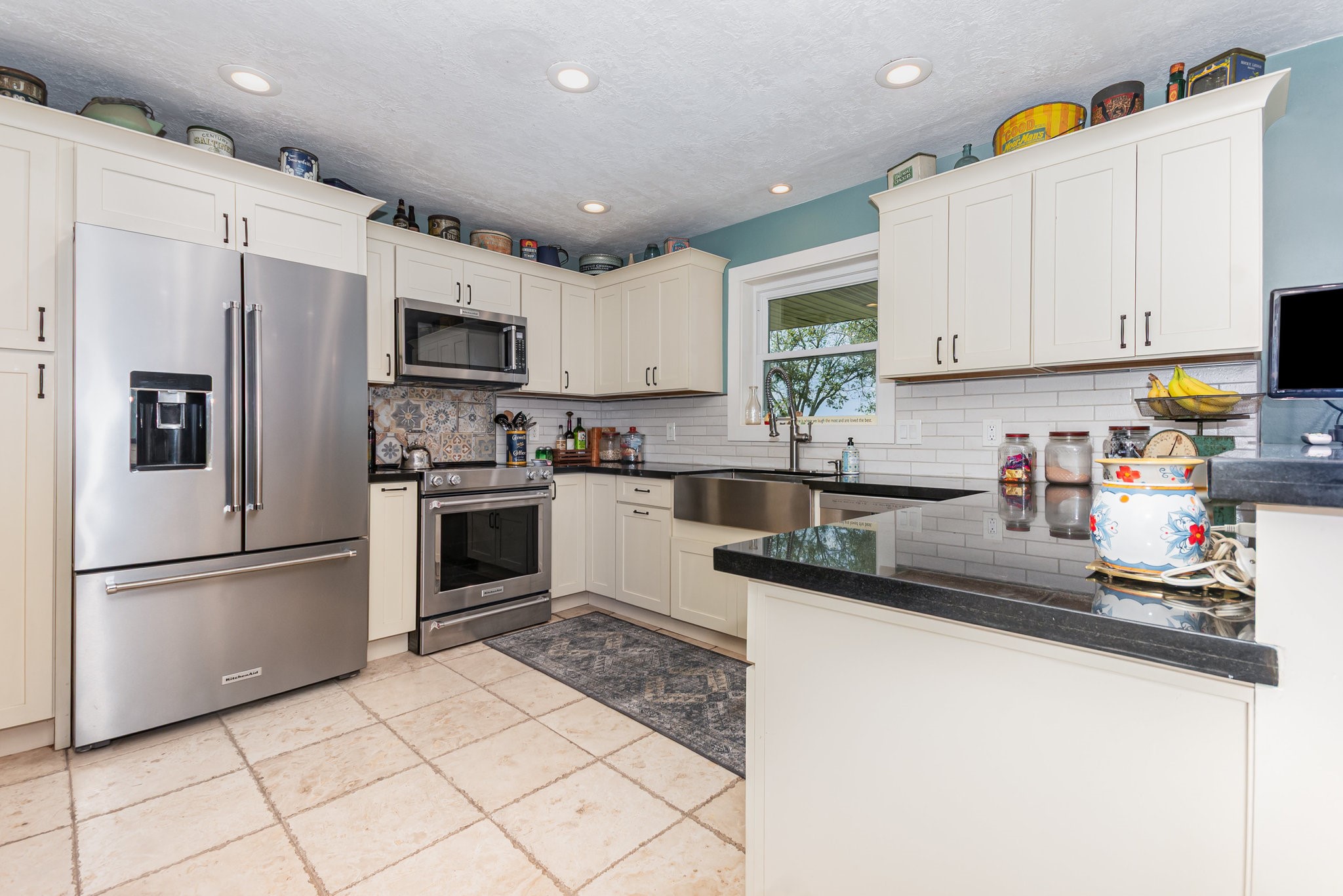 12009 Dannhaus Road Needville, TX 77461 - Photo 8 of 49 a kitchen with stainless steel appliances granite countertop a refrigerator sink stove microwave and cabinets