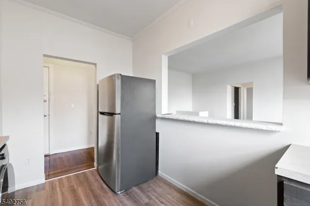 a view of cabinets and wooden floor