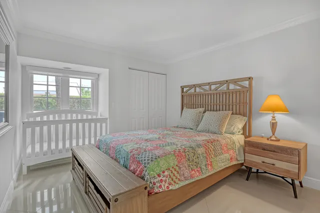 a bathroom with a bathtub shower sink vanity and mirror
