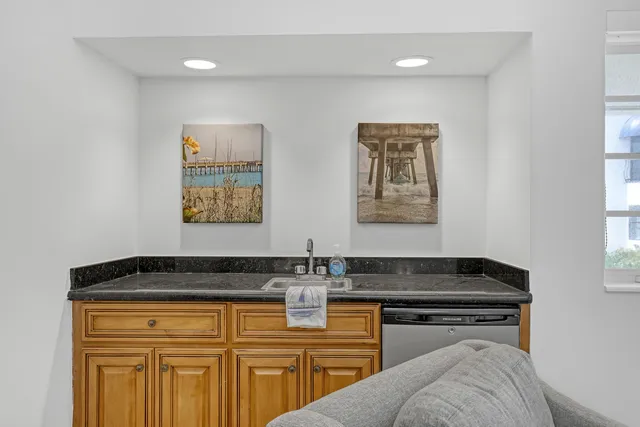 a view of a room with wooden floor and windows