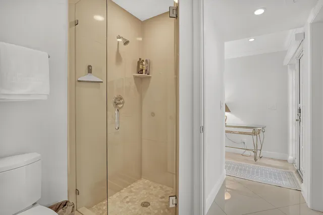 a view of a patio with table and chairs with wooden floor and fence