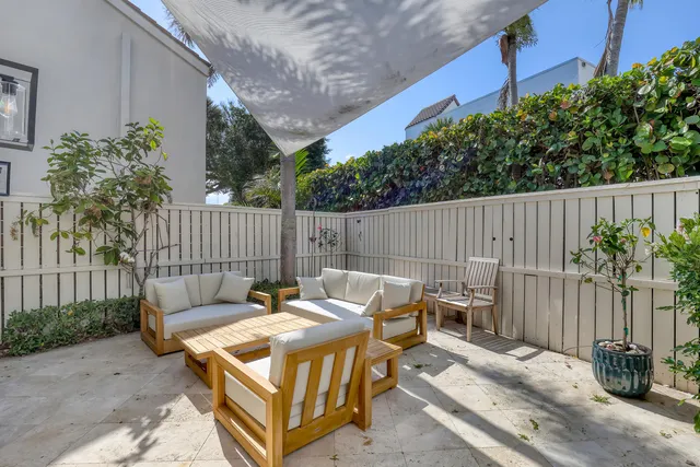 a kitchen with windows and refrigerator