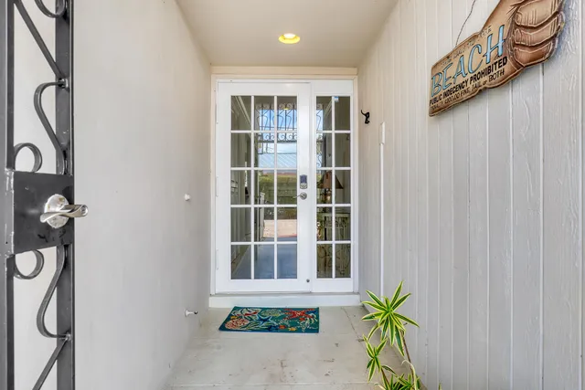 a view of swimming pool with outdoor seating and plants