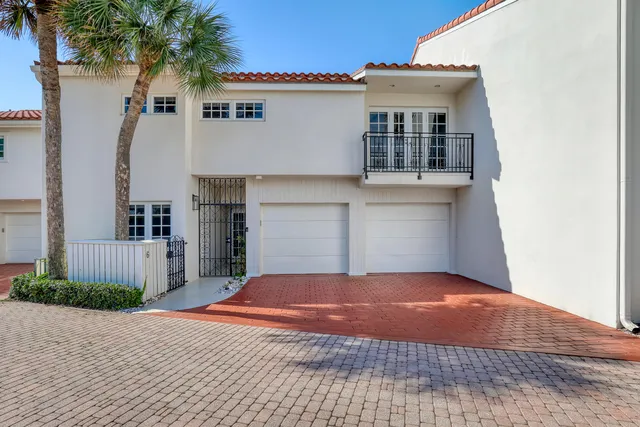 a view of a park with palm trees