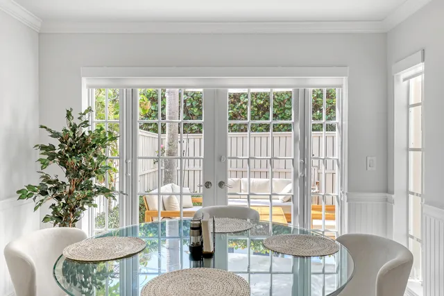 a dining room with furniture and wooden floor