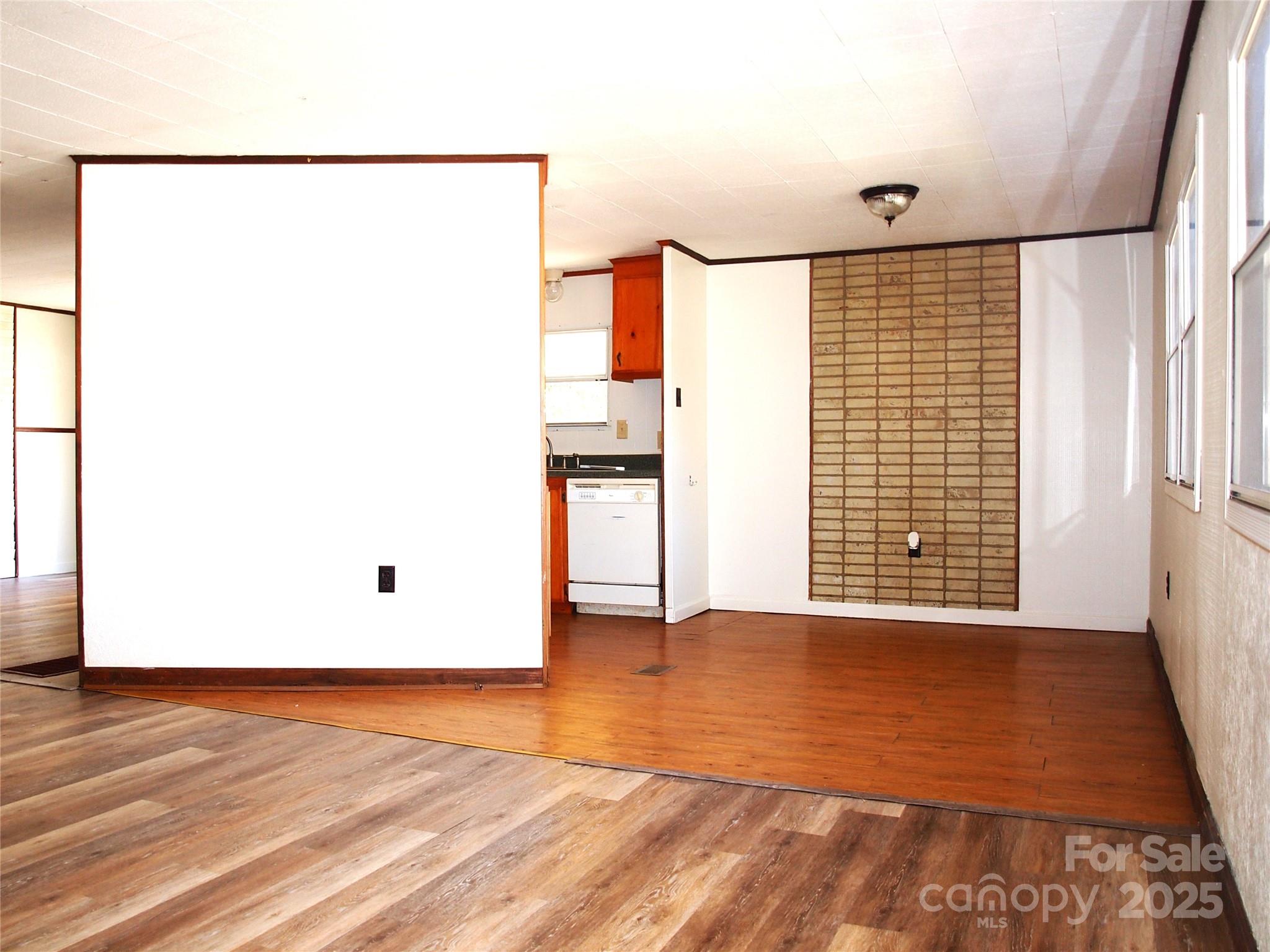 9 Smokey Cove Road Canton, NC 28716 - Photo 14 of 24 a view of an empty room with a window and a refrigerator