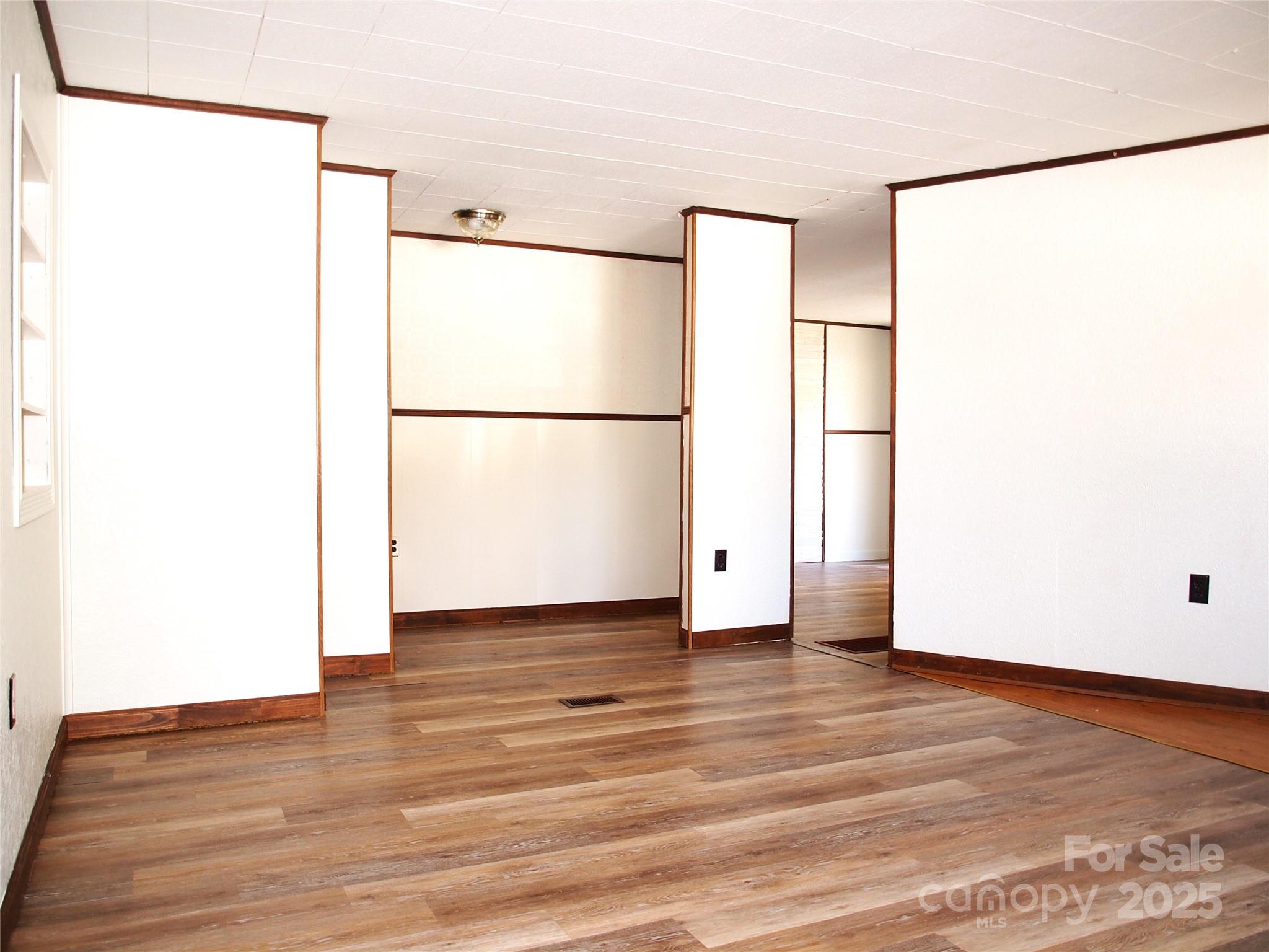 9 Smokey Cove Road Canton, NC 28716 - Photo 15 of 24 a view of a refrigerator with wooden floor