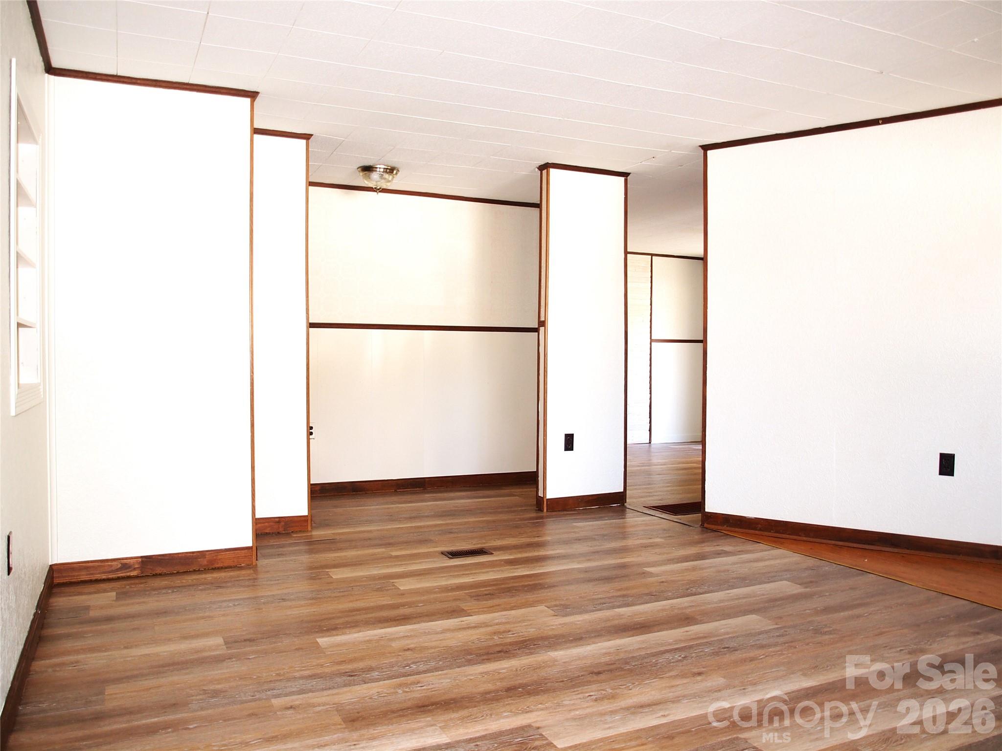 9 Smokey Cove Road Canton, NC 28716 - Photo 16 of 26 a view of a refrigerator with wooden floor
