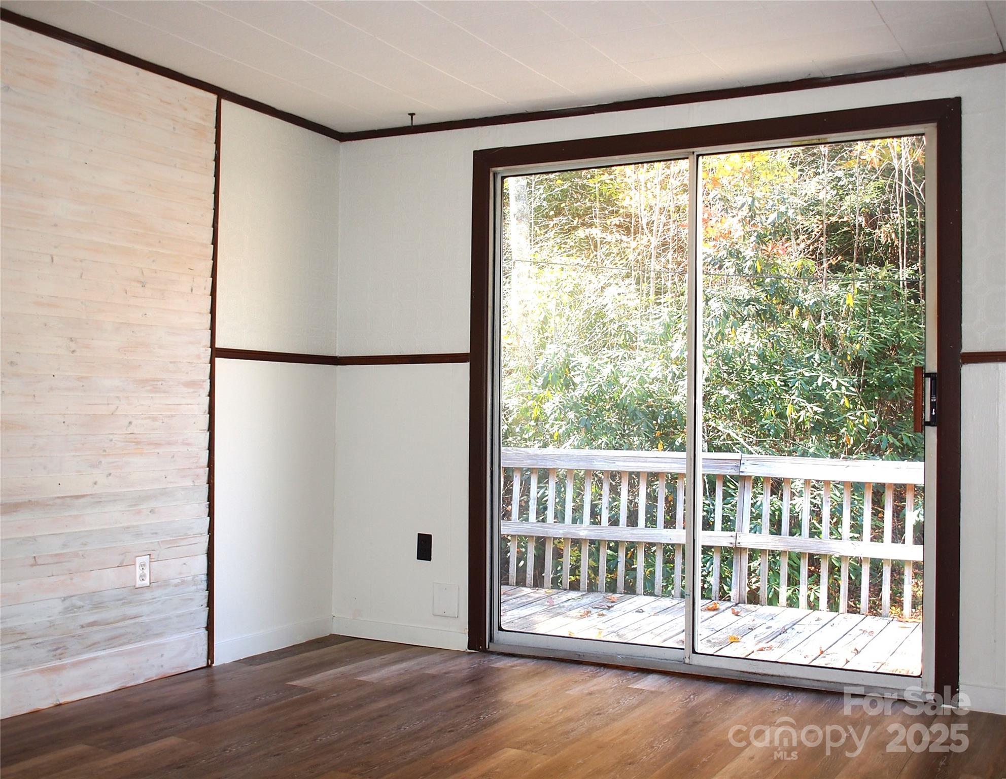 9 Smokey Cove Road Canton, NC 28716 - Photo 19 of 24 a view of a room with wooden floor and a window