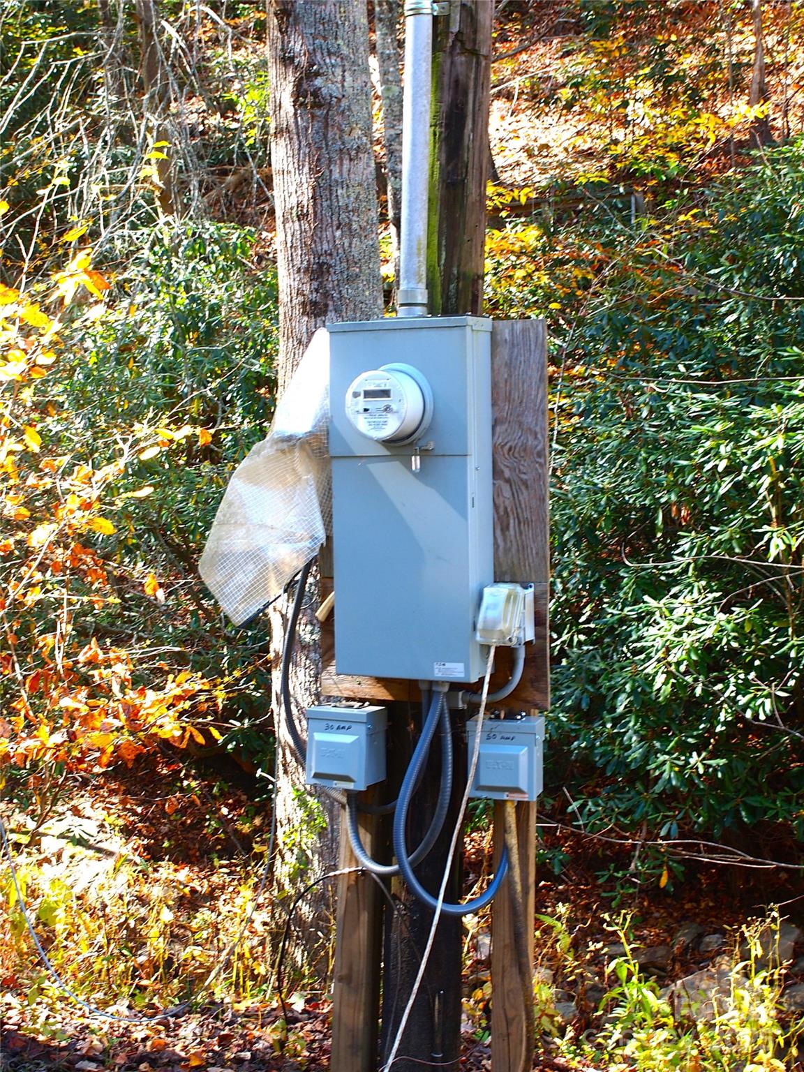 9 Smokey Cove Road Canton, NC 28716 - Photo 24 of 24 a backyard of a house with table and chairs
