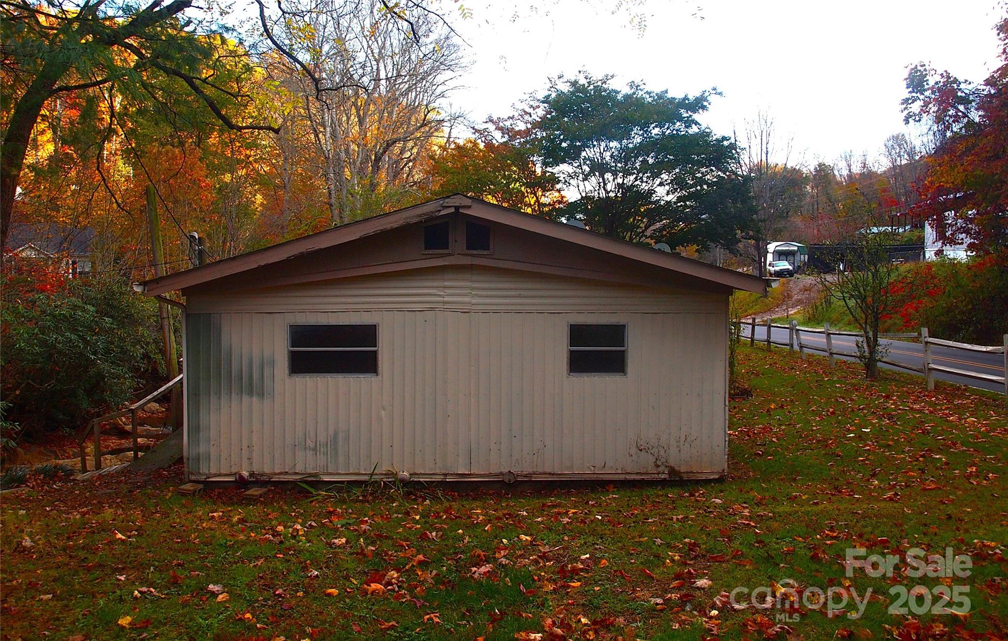 9 Smokey Cove Road Canton, NC 28716 - Photo 10 of 24 a house with trees in the background