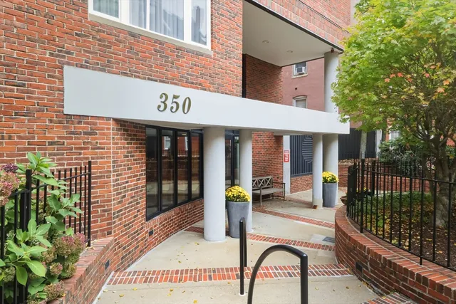 a front view of a building with glass windows and door
