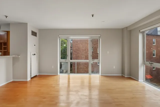 a view of an empty room with a window