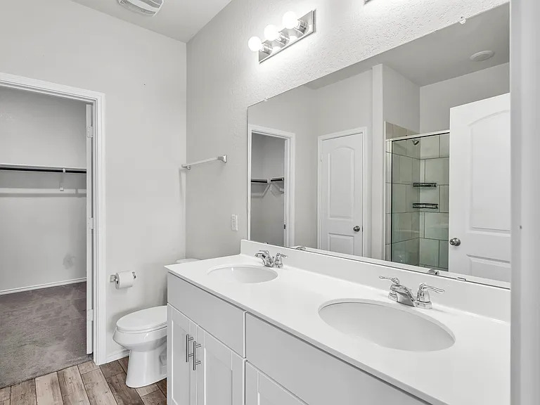 156 Janice Road Taylor, TX 76574 - Photo 12 of 29 Full bath with a shower stall, wood finished floors, a sink, and toilet