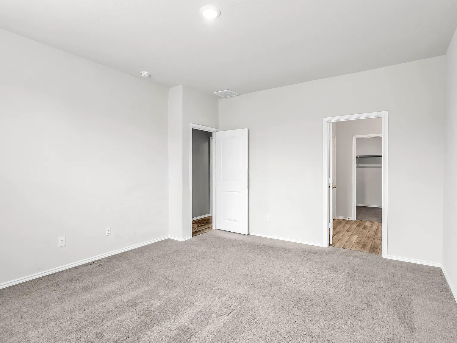 156 Janice Road Taylor, TX 76574 - Photo 14 of 29 Unfurnished bedroom featuring carpet floors, a spacious closet, visible vents, and baseboards