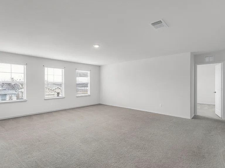 156 Janice Road Taylor, TX 76574 - Photo 16 of 29 Unfurnished room with visible vents, baseboards, and carpet
