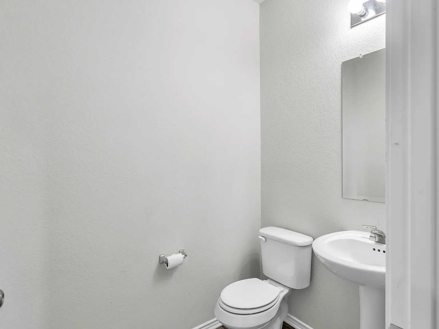 156 Janice Road Taylor, TX 76574 - Photo 18 of 29 Half bathroom featuring toilet and baseboards