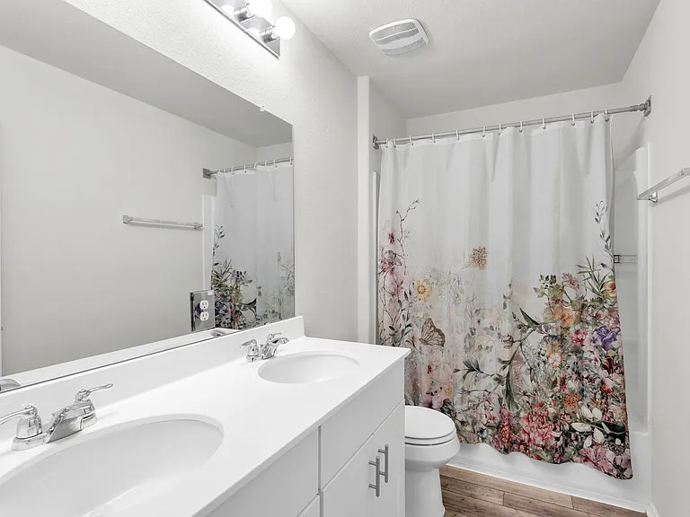156 Janice Road Taylor, TX 76574 - Photo 24 of 29 Bathroom with toilet, wood finished floors, a sink, and visible vents