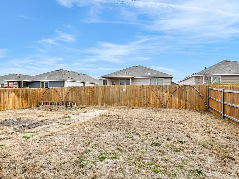 156 Janice Road Taylor, TX 76574 - Photo 25 of 29 View of yard featuring a fenced backyard