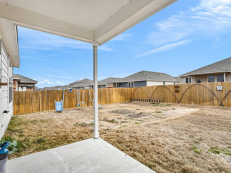 156 Janice Road Taylor, TX 76574 - Photo 29 of 29 View of yard with a fenced backyard and a patio