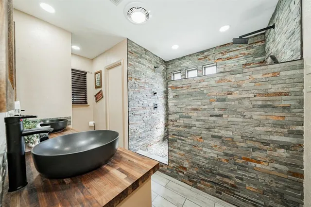 a room with a wooden floor and a sink