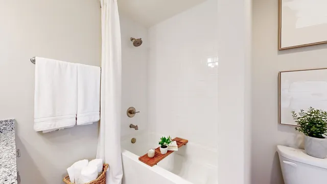 a bathroom with a sink toilet and tub