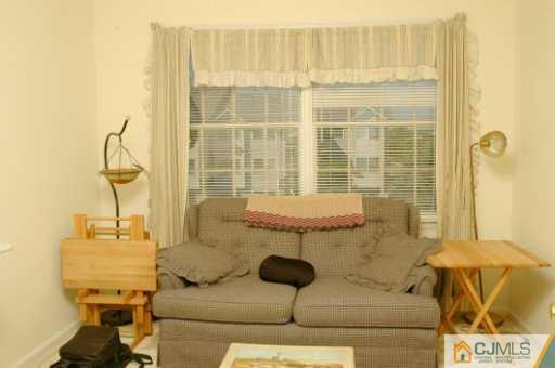 437 Edpas Road New Brunswick, NJ 08901 - Photo 5 of 8 a living room with furniture and a window