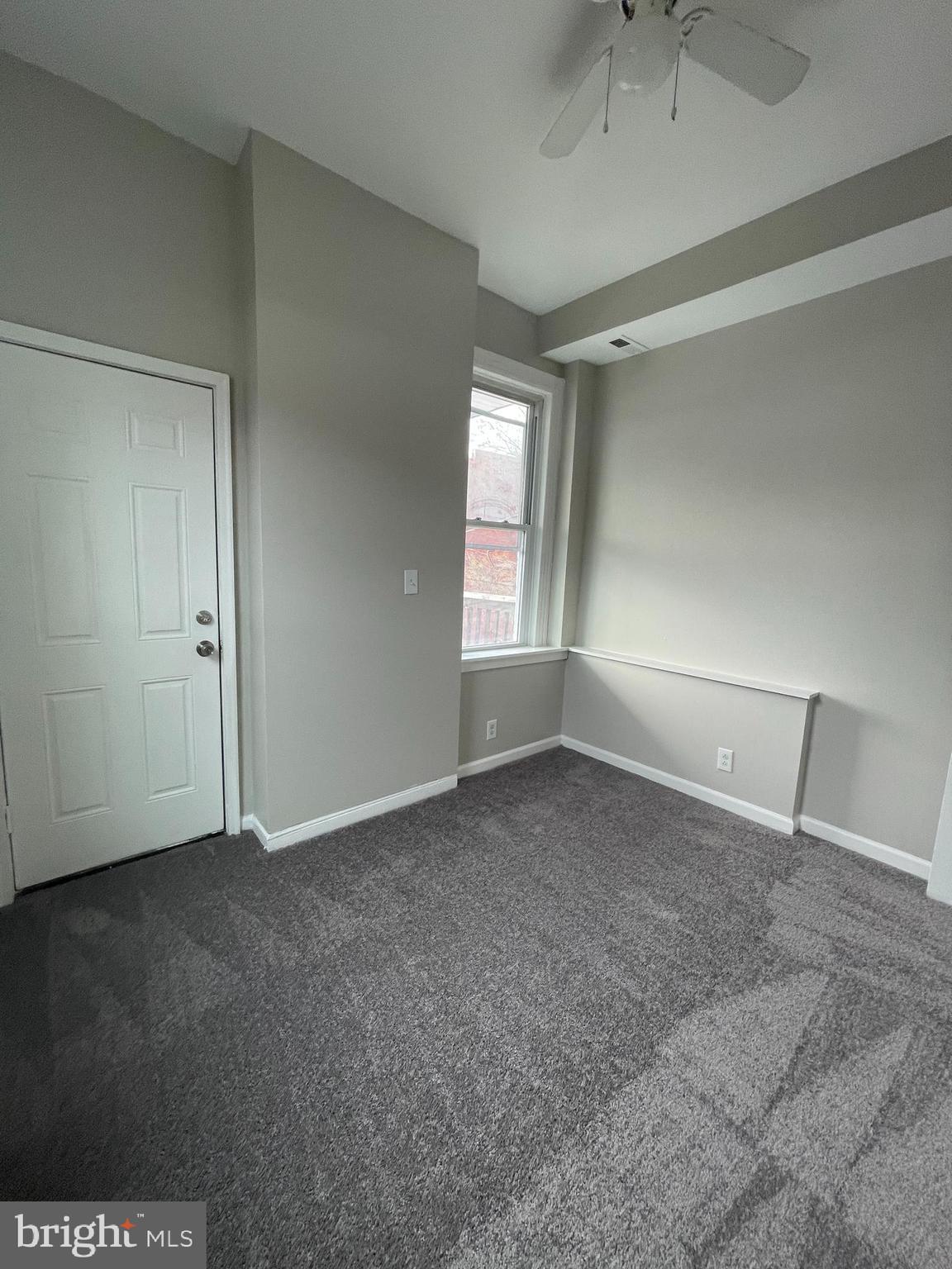 1426 McCulloh Street, Unit 2 Baltimore, MD 21217 - Photo 14 of 25 an empty room with windows and closet